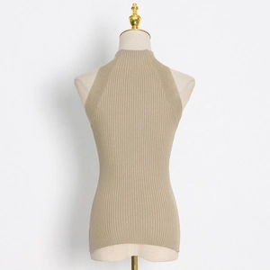 Detailed close-up of light beige ribbed knit sleeveless top with chic high neckline texture
