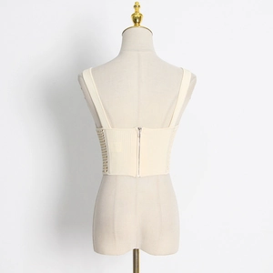 Slim fit hollow knit vest with fishbone waist and back zipper in beige color