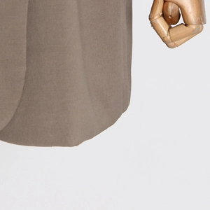 Detail of khaki twill blazer fabric showing premium drape and precise edge stitching