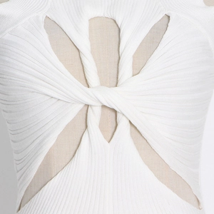 Detail of white ribbed knit top featuring a front knot and symmetrical hollow cut-out design