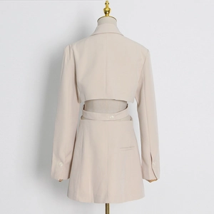Detailed back view of beige blazer with stylish hollow-out design and waist strap button