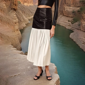 Street style pleated leather midi skirt with high waist mesh stitching and black leather detail