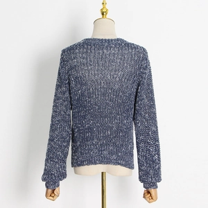 Back view of heavy-knit mixed blue and white sweater with chunky textured weave