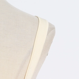 Close-up of beige elastic knit shoulder strap with fine texture on a mannequin