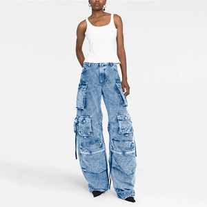 Detailed view of women's multi-pocket cargo pants in vintage washed blue denim fabric
