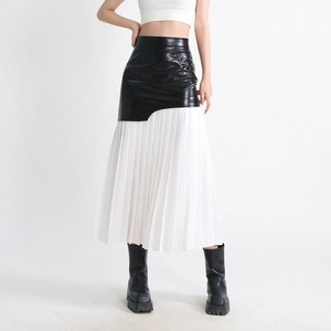 Detail of high-waist pleated midi skirt featuring black PU leather and white mesh splicing