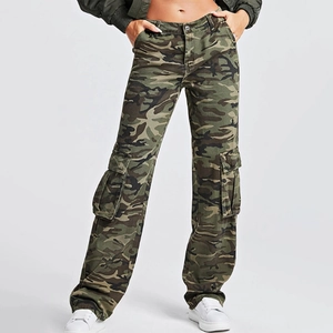 Detailed view of cargo denim pants with woodland camouflage pattern and side flap pockets