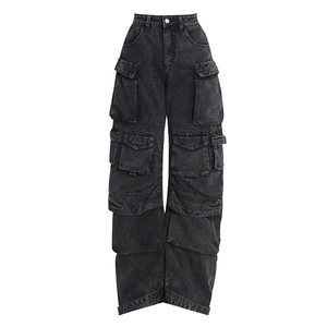 Detailed view of high-waist washed black denim jeans with multiple large cargo pockets