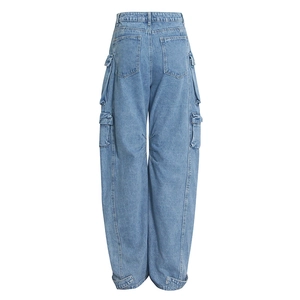 Rear view of light blue washed denim cargo pants showing symmetric pockets and wide leg
