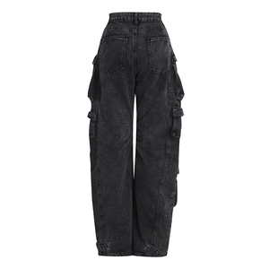 Macro detail of acid wash texture and back cargo pockets on vintage grey wide-leg pants