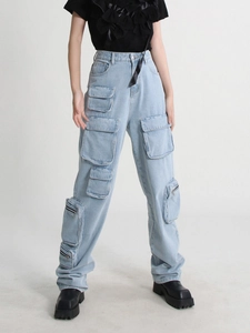 High-waisted light blue wide-leg cargo jeans with multiple utility pockets and zip detail