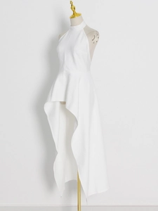 Detail of white halter neck top with high-low hem and structured woven fabric texture