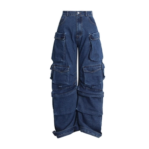 Detailed macro view of heavy-duty denim stitching and multi-pocket cargo pants design