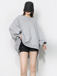 Oversized grey crewneck sweatshirt featuring dropped shoulders and relaxed fit for women