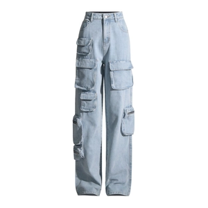 Detailed macro view of light blue denim cargo jeans with functional side pockets and zippers