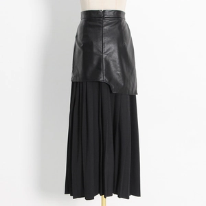 Close-up of the high waist spliced faux leather and pleated mesh skirt detail in black