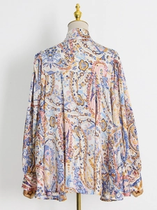 Detailed back view of vintage paisley print long sleeve shirt with relaxed fit drape