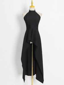 Detail of elegant black halter neck dress with asymmetrical hi-low hemline on mannequin