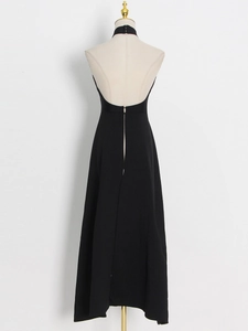 Back view of elegant halter neck dress with deep open back and floor-length silhouette