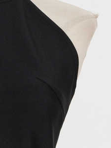 Detail of black halter neckline with fine ribbed texture and premium stitching