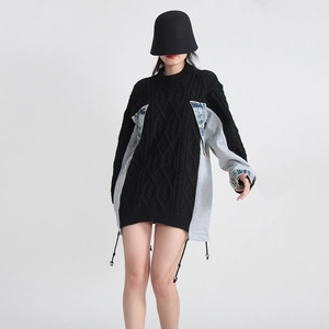 Detail view of knitted sweater with denim patchwork and adjustable drawstring hem