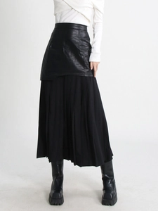 Chic high-waist pleated midi skirt with black leather patchwork and sheer mesh detailing