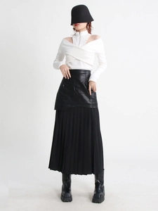 Street style pleated leather skirt with mesh layers and high waist in a avant-garde design