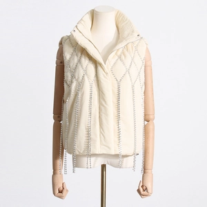 Detail of off-white quilted vest with crystal fringe tassels and stand collar