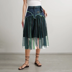 Detail of denim waist with double belts and sheer pleated mesh splicing on the midi skirt