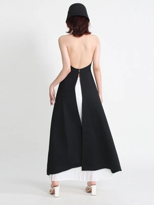Chic black halter backless dress paired with white pleated skirt for women