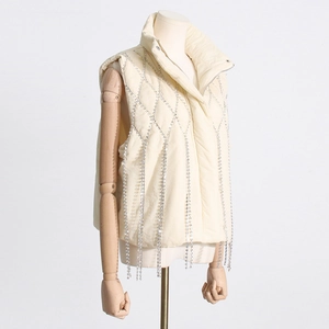 Close-up of cream white stand-collar puffer vest featuring sparkling rhinestone fringe