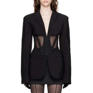 Close-up of a black blazer with corset boning and sheer mesh panels for a slim fit design