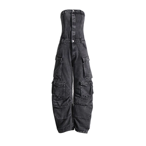 Detail of cargo pockets on a strapless high-waisted denim jumpsuit in dark grey