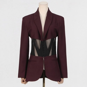 Close-up of wine red blazer with black sheer mesh waist panel and tailored fit
