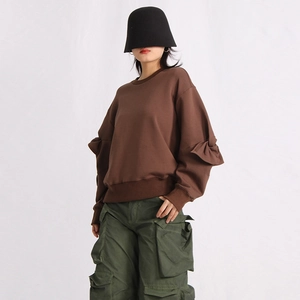 Detail of coffee oversized sweatshirt with pleated ruffles on sleeves and round neckline