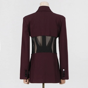 Detail view of wine red blazer with sheer black mesh panel on the back and buttons