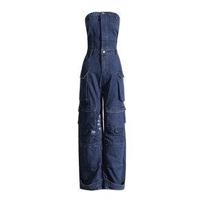 Detailed view of dark blue denim cargo jumpsuit with multiple pockets and strapless design