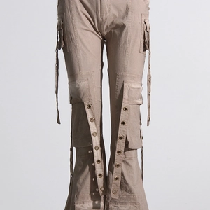 Detailed view of cargo pants with metal eyelets, long ribbons and twill fabric texture