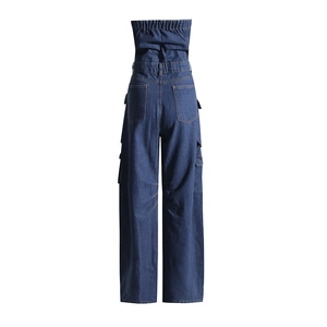Back view of denim jumpsuit showing elastic high waist and large utility cargo pockets