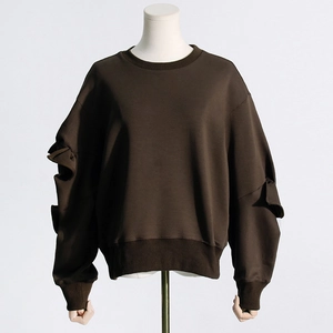 Detail view of coffee brown sweatshirt featuring layered ruffle design on long sleeves