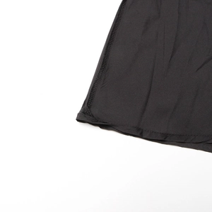 Detail view of the fine stitching and durable double seams on this black tulle midi skirt