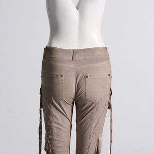 Rear view of khaki flare cargo pants featuring patch pockets and industrial straps