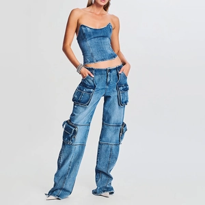 Detail of high-waist cargo jeans featuring multiple oversized pockets and denim texture