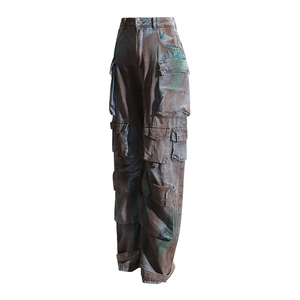 Detail view of multi-pocket cargo pants with vintage washed texture and utility pockets