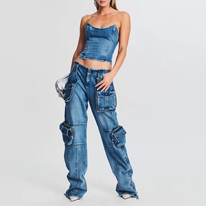 Detail of high-waisted cargo jeans with large side zip pockets and utility styling