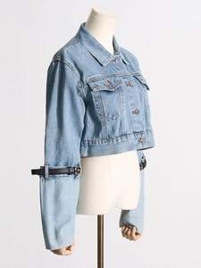 Short denim baseball jacket with contrast leather belts and silver metal rings