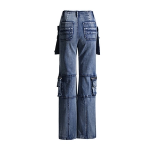Detail view of high waist cargo jeans back pockets and side zip utility compartments