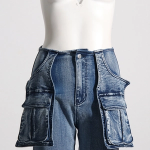 Detailed close-up of high-waisted workwear jeans featuring utility pockets and washed denim