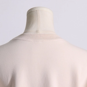 Detail of round neckline with high-quality stitching and ribbed knit fabric on sweatshirt