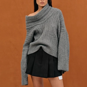 Detail of loose dark grey ribbed knit sweater with irregular off-shoulder neckline design